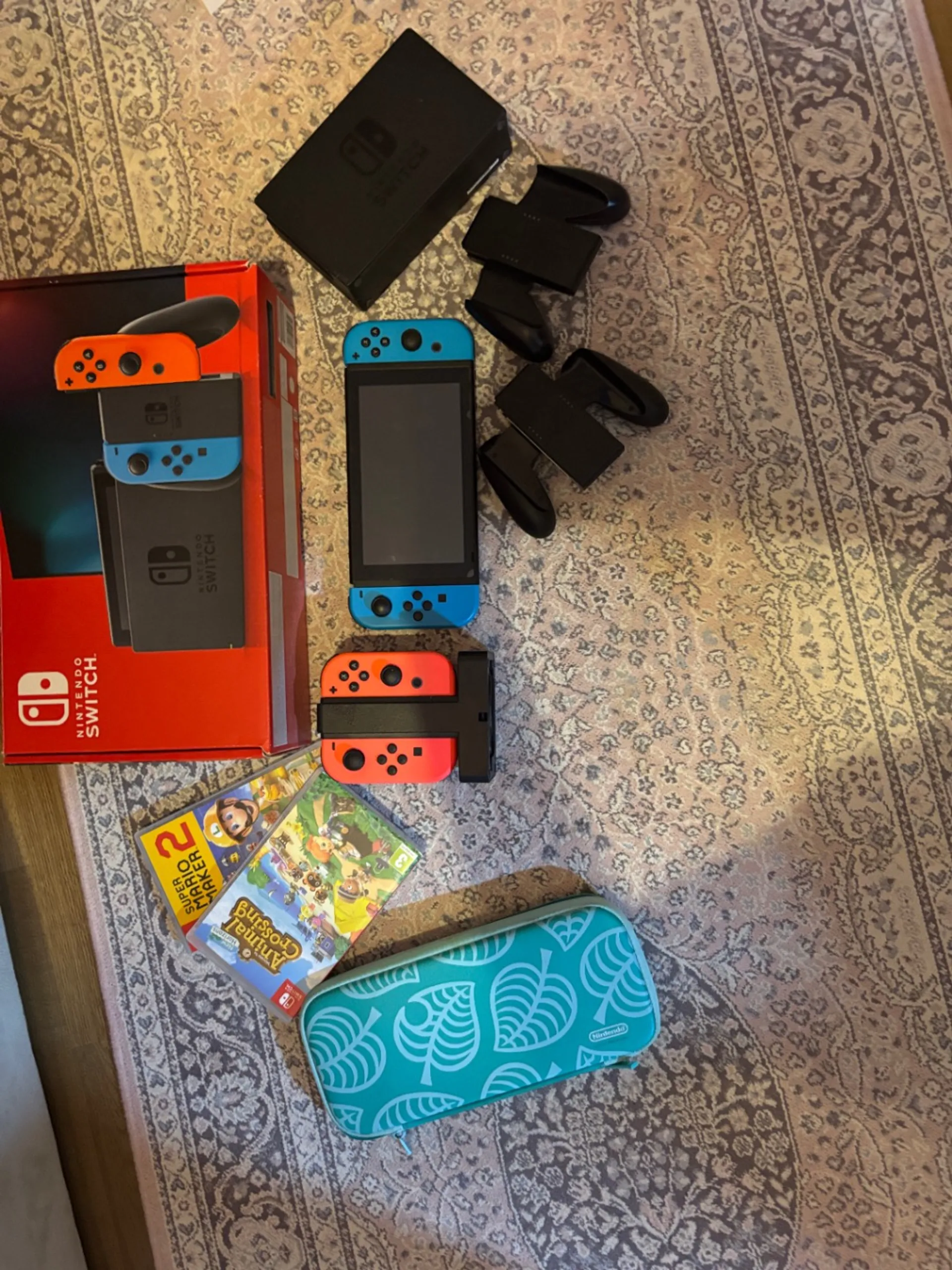 Nintendo Switch game console with accessories, two games and Animal Crossing cover, photo 1 of 1